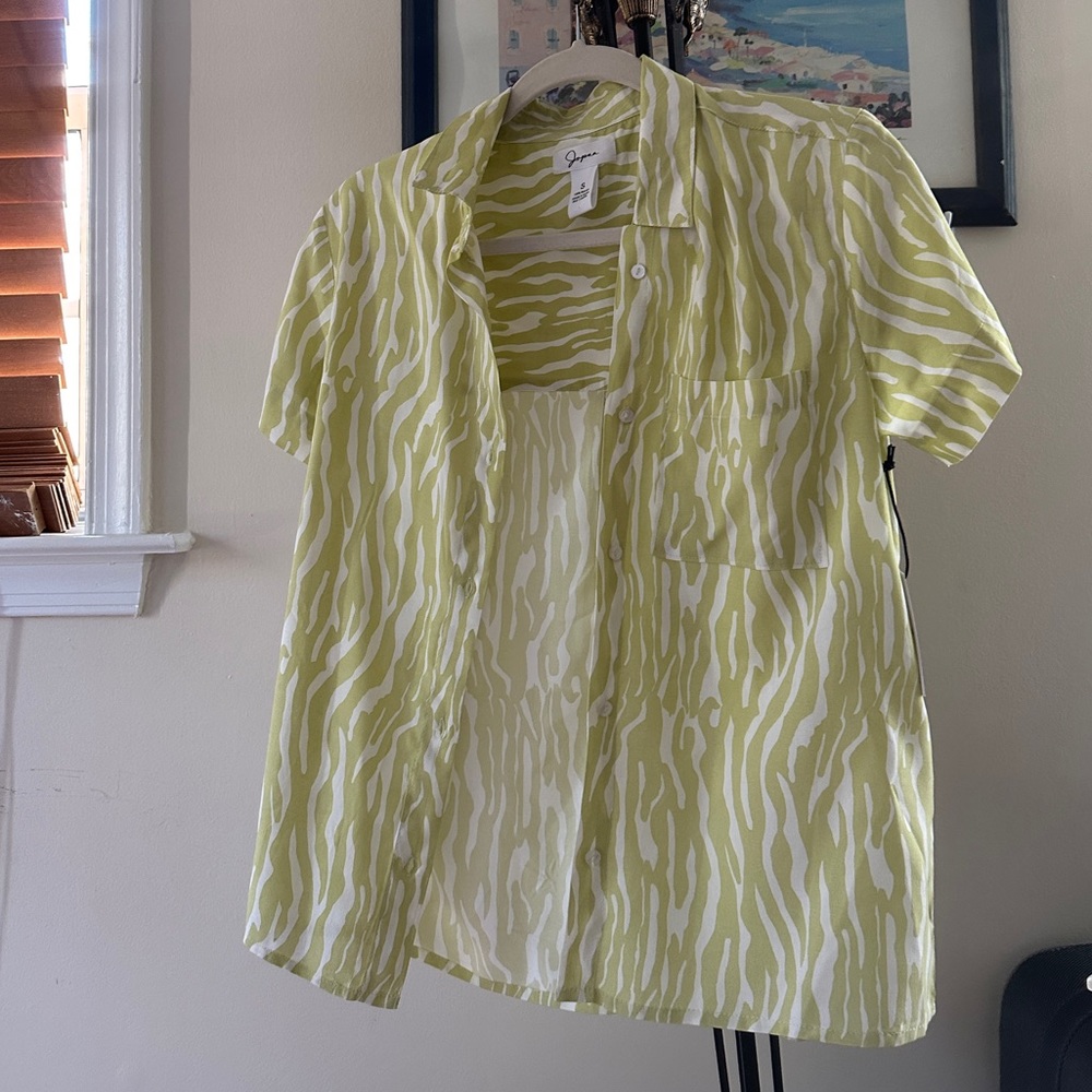 Brand new printed shirt with tag. Fit for small size. Beautiful green print.